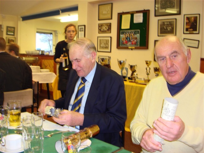 john pickup closely studies the lrafc cracker contents - whilst dick harper recounts the les ferdinand story.jpg